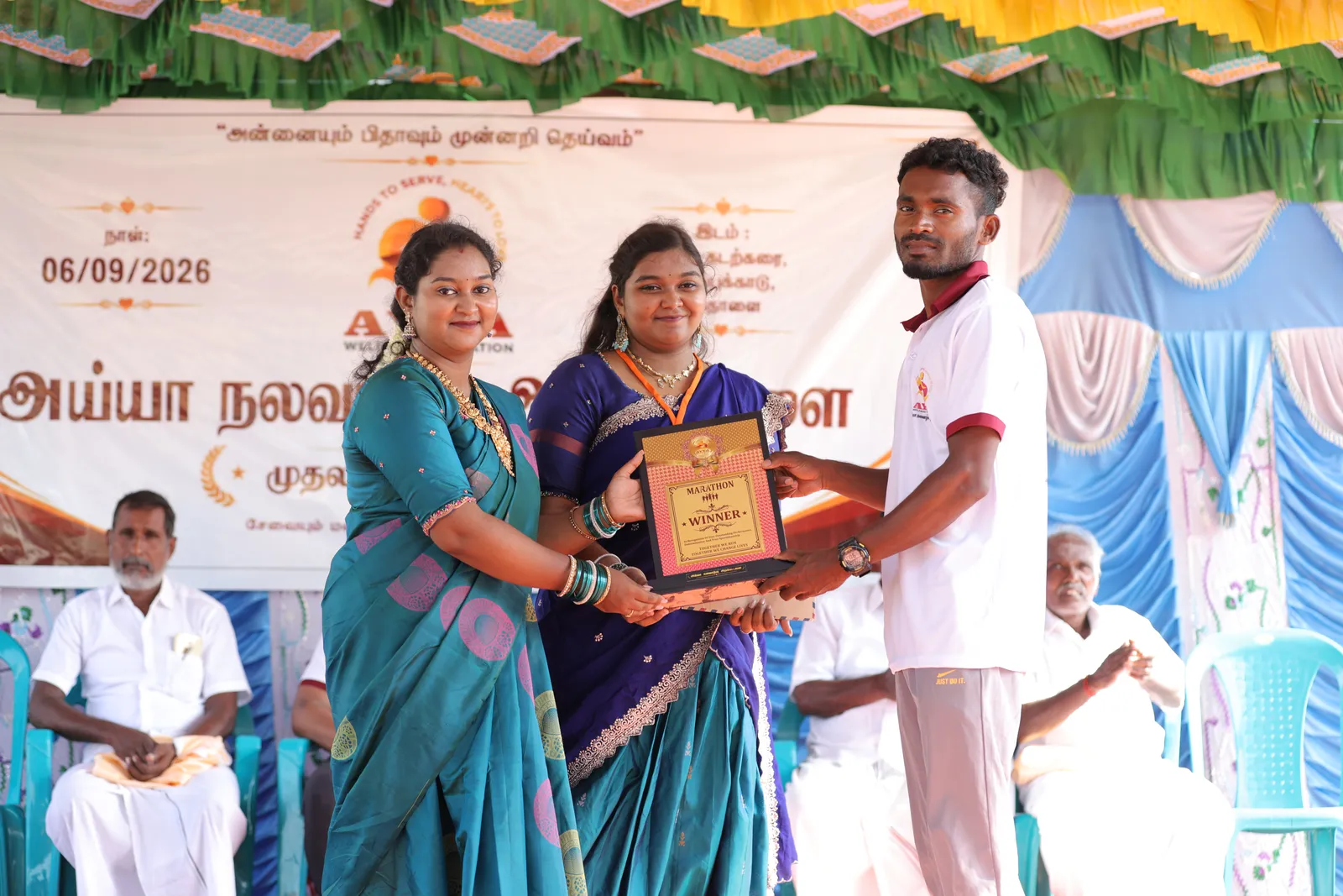 Marathon winner being honoured at Ayya Welfare Foundation's first anniversary